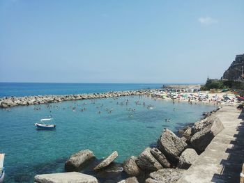 Scenic view of sea against blue sky