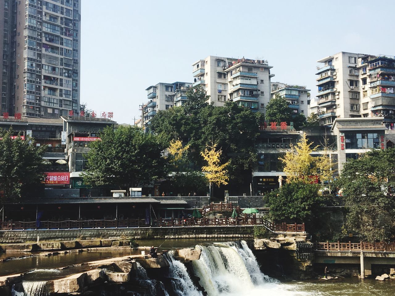 CANAL AMIDST BUILDINGS AGAINST SKY