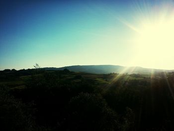 Sun shining over landscape