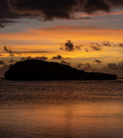 Scenic view of sea against romantic sky at sunset