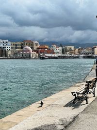 Scenic view of sea against buildings