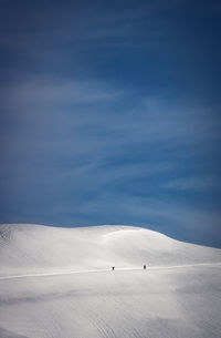 View of snowcapped mountain against cloudy sky