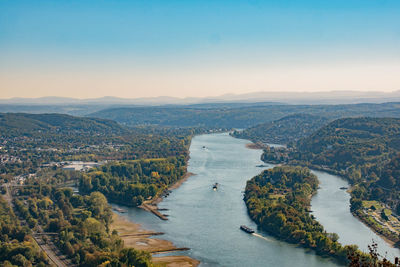 High angle view of river amidst cityscape against sky