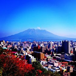 Scenic view of mountains against clear blue sky