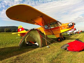 Tent on field against sky