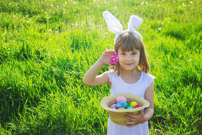 High angle view of girl picking flowers