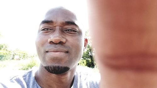 Portrait of mature man against sky