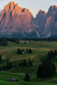 Scenic view of landscape and mountains against sky at alpe di siusi