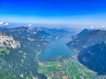 Aerial view of mountain range against cloudy sky