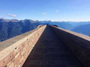 View of mountain range against blue sky