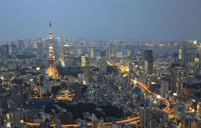 Aerial view of city lit up at night