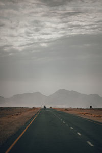 Empty road against sky