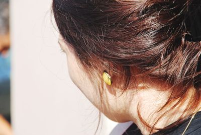 Close-up of woman wearing earring