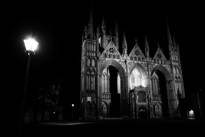 Low angle view of illuminated street light at night