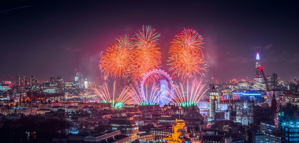 Low angle view of illuminated city at night