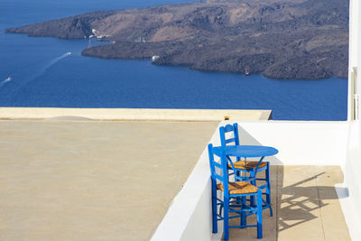 High angle view of chairs on beach