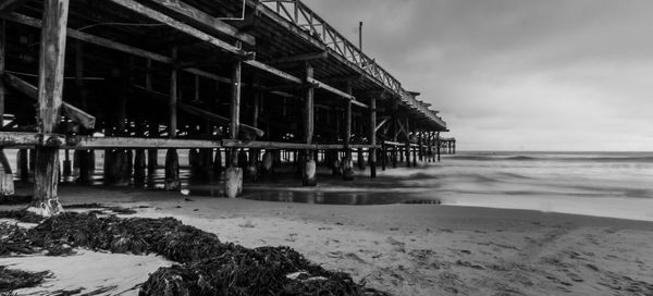 Pier over sea against sky