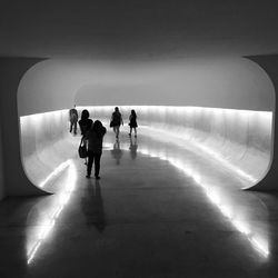 People walking in tunnel