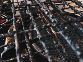 Full frame shot of rusty metal fence during winter