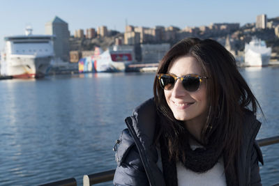 Portrait of a smiling young woman in city