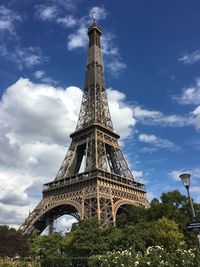 Low angle view of tower against cloudy sky