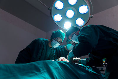 People working in illuminated room