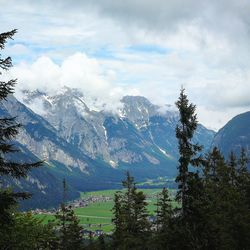 Scenic view of snowcapped mountains against sky