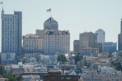 Buildings in city against sky