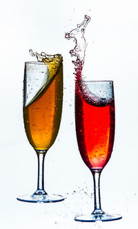 Close-up of wine in glass against white background