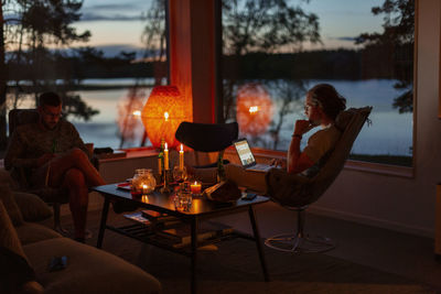 Men relaxing at home in evening