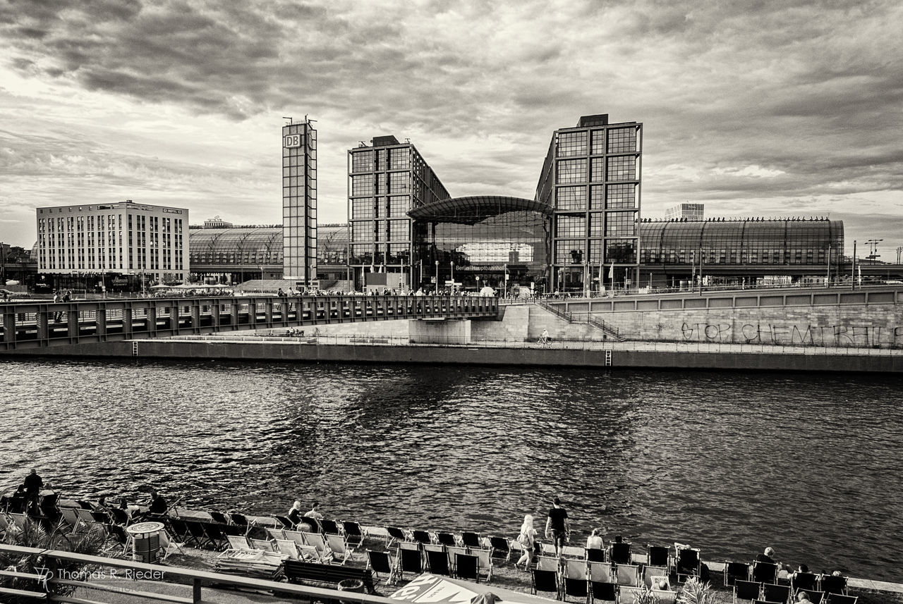 architecture, city, building exterior, built structure, sky, travel destinations, outdoors, water, travel, skyscraper, cityscape, day, no people, cloud - sky, modern, urban skyline, bridge - man made structure