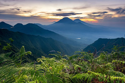 Scenic view of mountains against sky during sunset