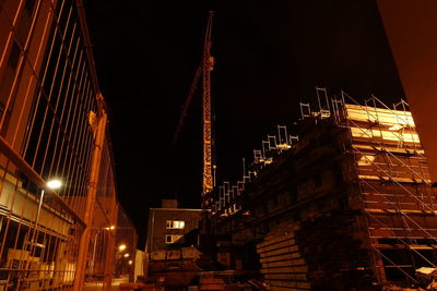 Low angle view of illuminated building at night