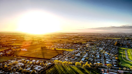 High angle view of illuminated city against sky