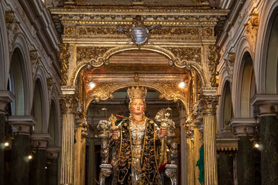 Low angle view of statue in illuminated building