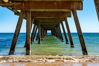 Pier over sea against sky