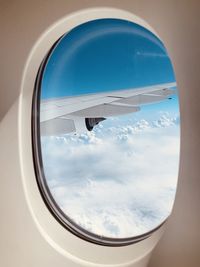 Airplane wing seen through window