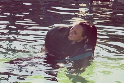 Portrait of woman swimming in pool