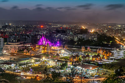 Shree swaminarayan temple with nice cloudscape at night, pune, india.