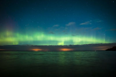 Scenic view of sea against sky at night