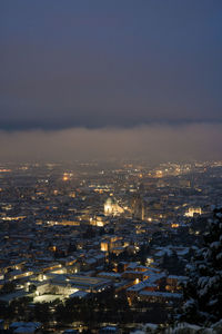 High angle view of illuminated buildings in city at night