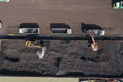 High angle view of people on coal mining activity