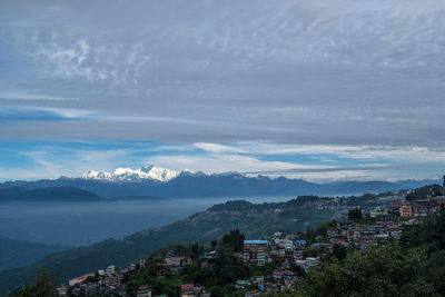 High angle view of townscape and mountains against sky