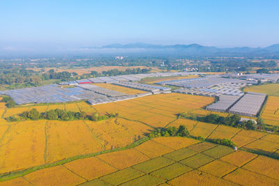 Aerial view of agricultural field against sky