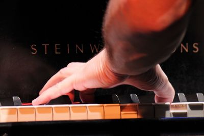 Cropped image of pianist playing piano