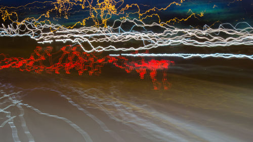 Light trails in sea at night