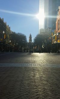 Sun shining through city