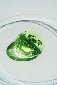 Green gel texture of a cosmetic care product.