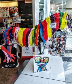 Multi colored umbrellas hanging in store