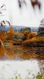 Reflection of trees in lake against sky during autumn